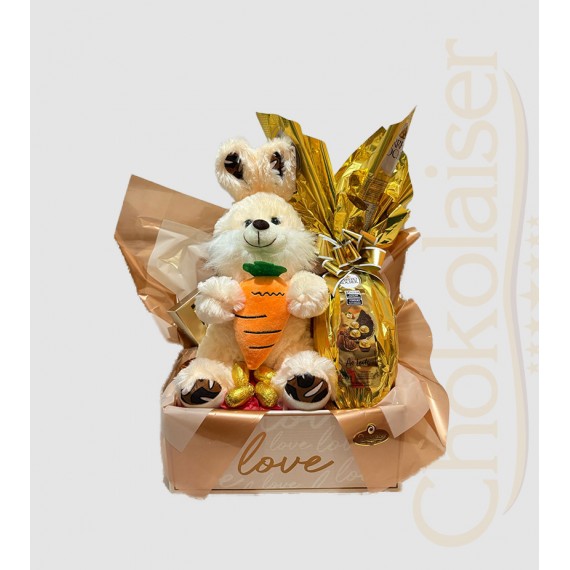 Cesta com coelhinho de pelúcia com cenoura de pelúcia, ovo de páscoa  ferrero rocher
